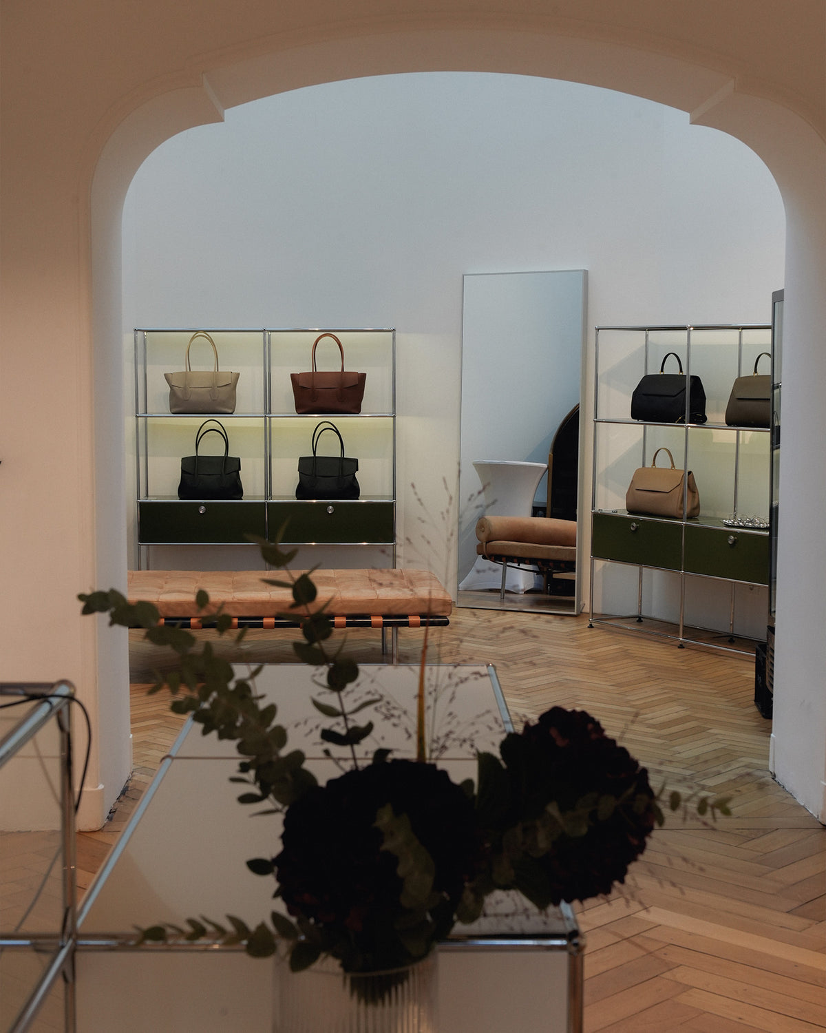 ALEMI Zurich | Munich Store | Store interior with handbags displayed on shelves