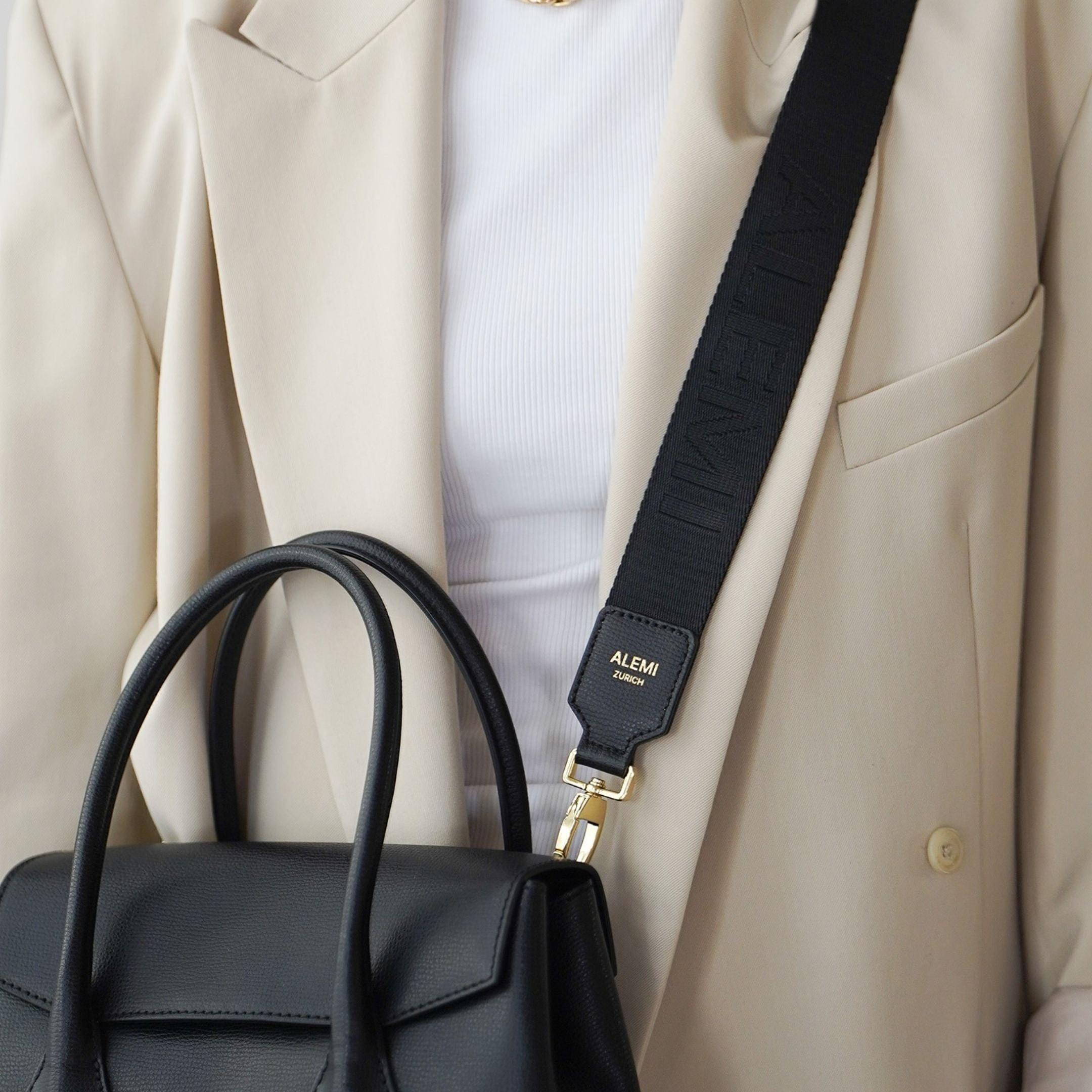 ALEMI Zurich | Adjustable Strap | Black | Pebbled Leather | Model Crossbody on Ida Small Bag