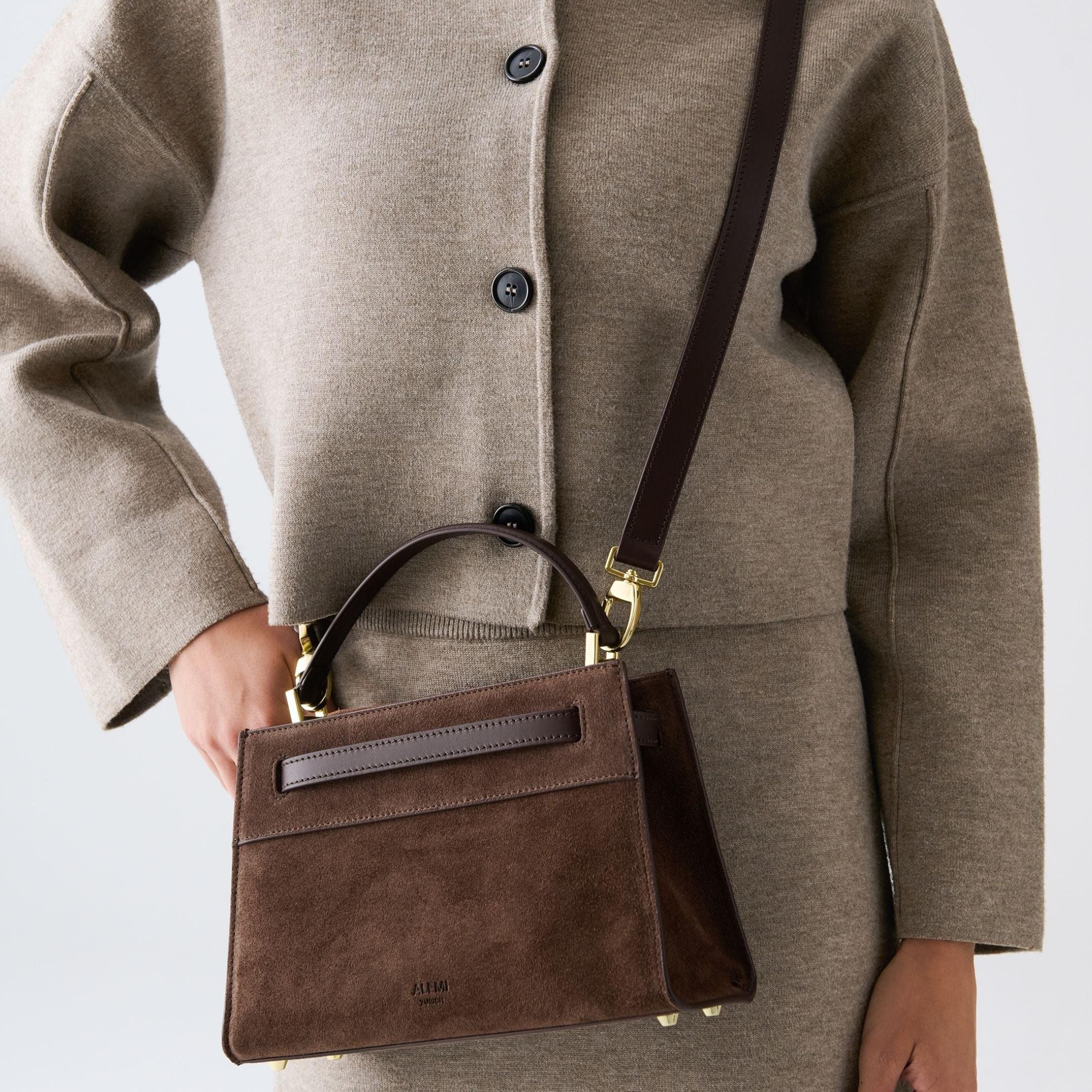 ALEMI Zurich | SEEFELD MINI | Small Bag | Dark Brown | Suede Leather | Model carrying bag by strap close up