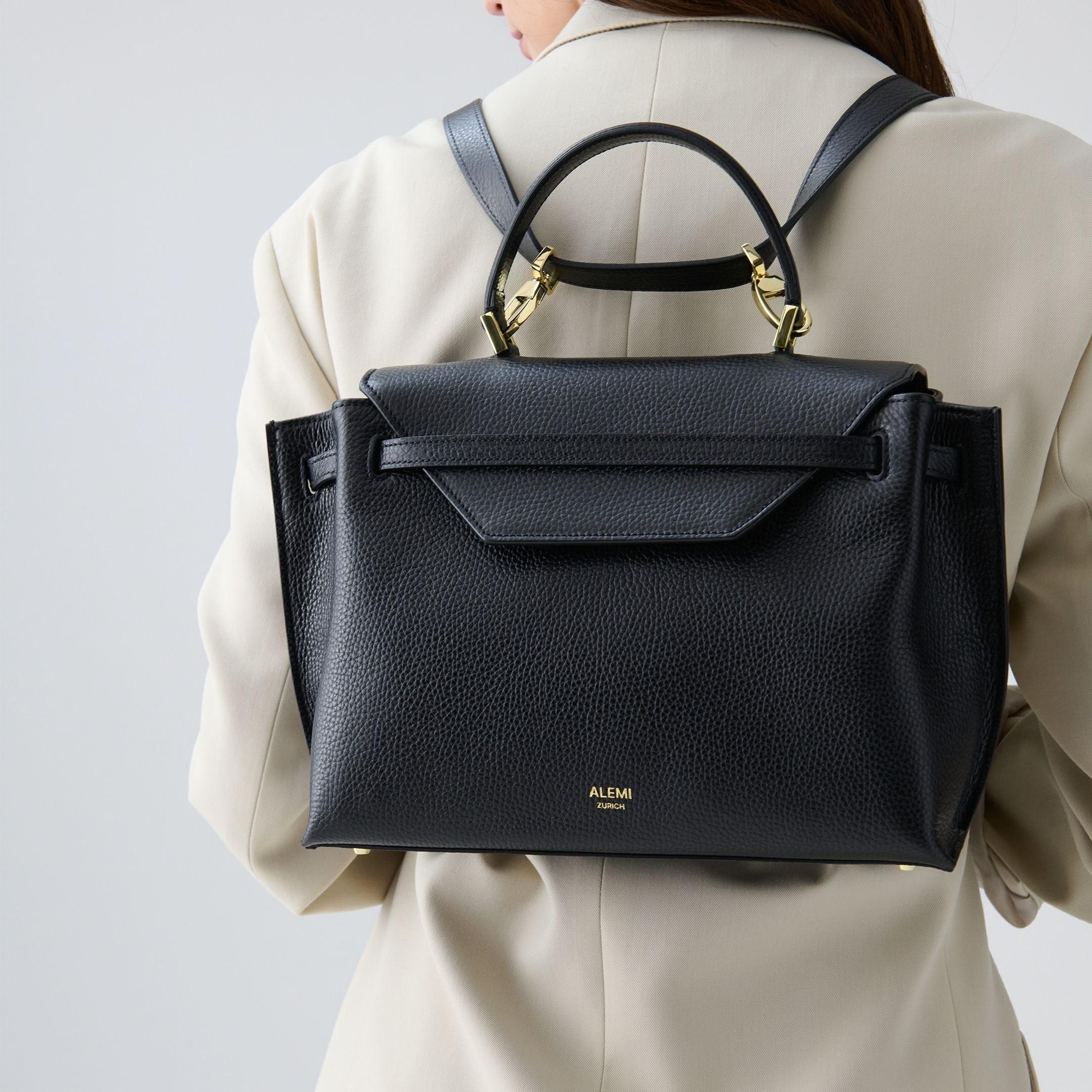 ALEMI Zurich | VIADUKT | Small Bag | Black | Soft Grain Leather | Model carrying bag as backpack