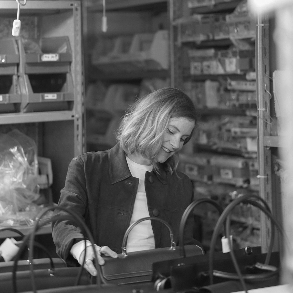ALEMI Zurich | VIADUKT WORK | Craftsmanship | Founder Christina checking bags in production