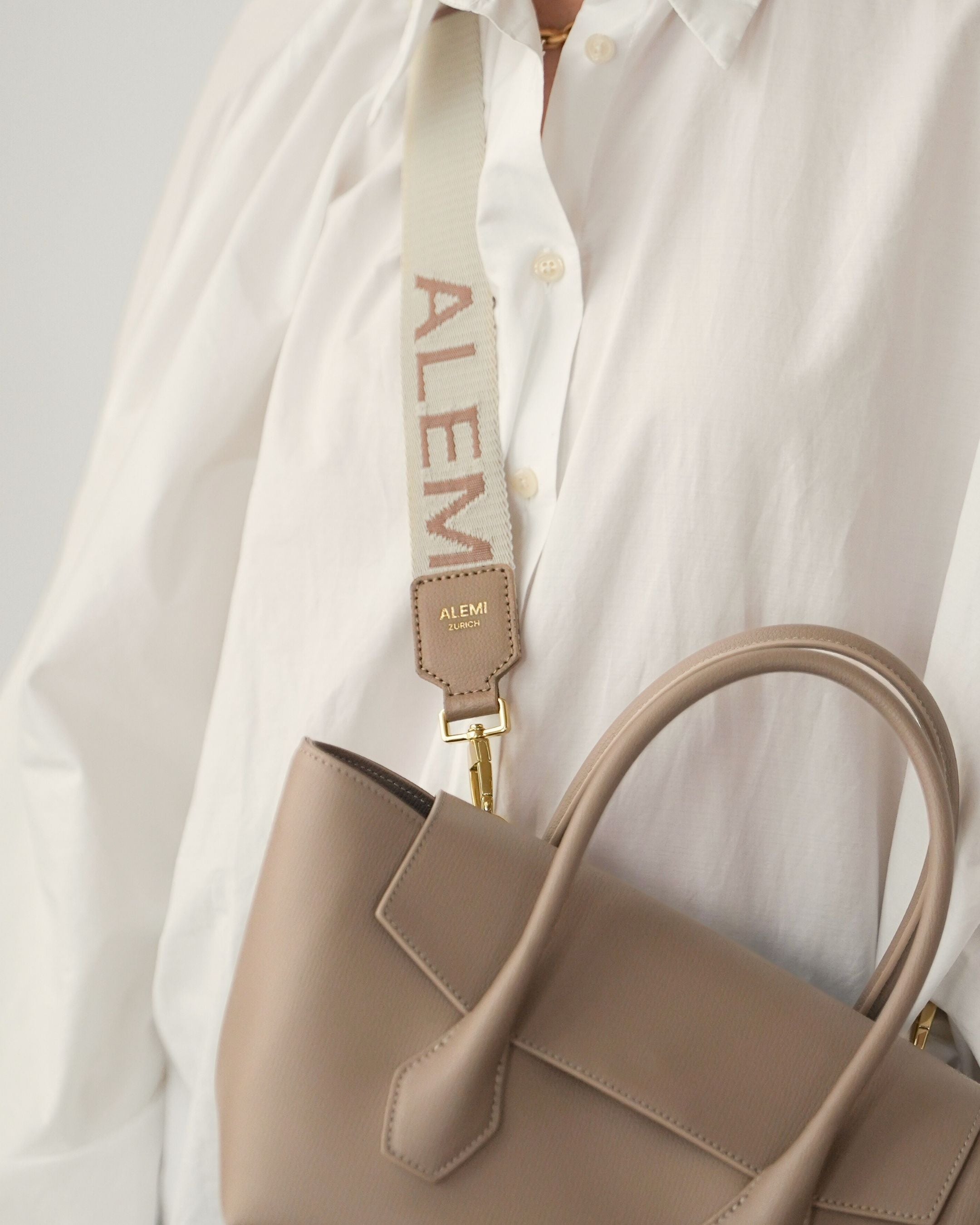 ALEMI Zurich | Adjustable Strap | Greige | Pebbled Leather | Model Crossbody on Ida Small Bag