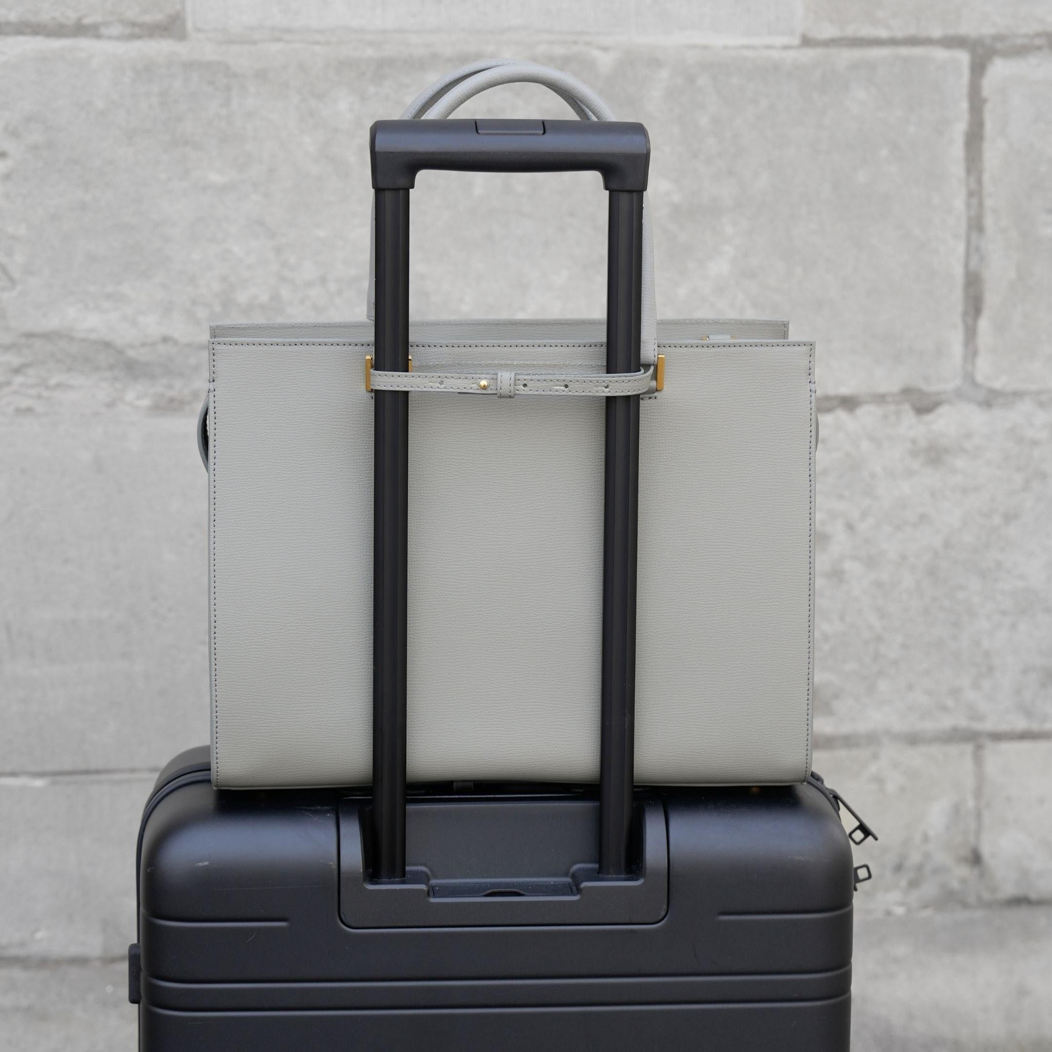 ALEMI Zurich | CENTRAL | Laptop Bag | Slate Gray | Pebbled Leather | Bag on suitcase
