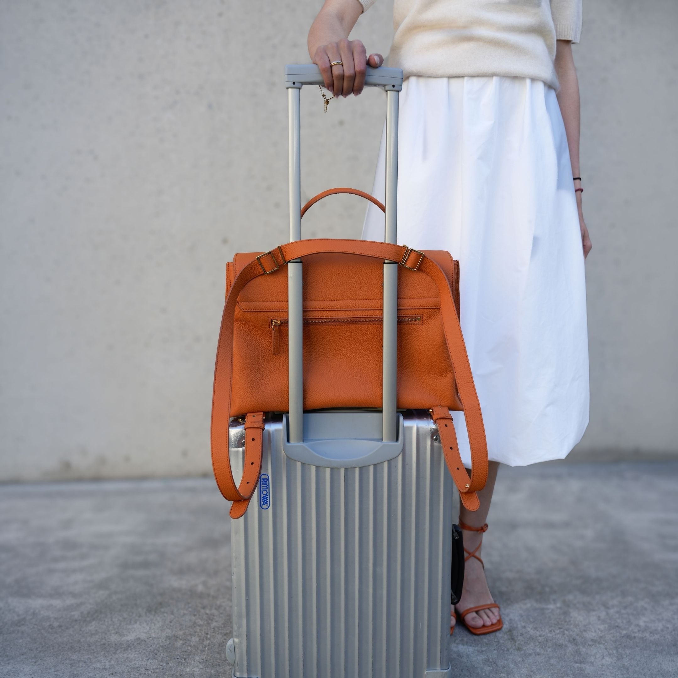 ALEMI Zurich | VIADUKT WORK | Laptop Bag | Burnt Orange | Soft Grain Leather | Bag on suitcase